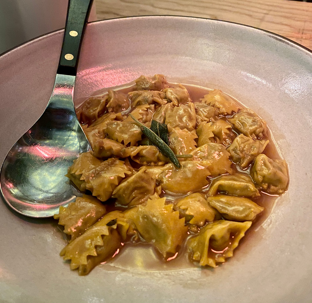 Cotogna signature dishes Agnolotti del PlinSpit-Roasted Pork LoinProsciutto di Parma with Gnocco Fritto